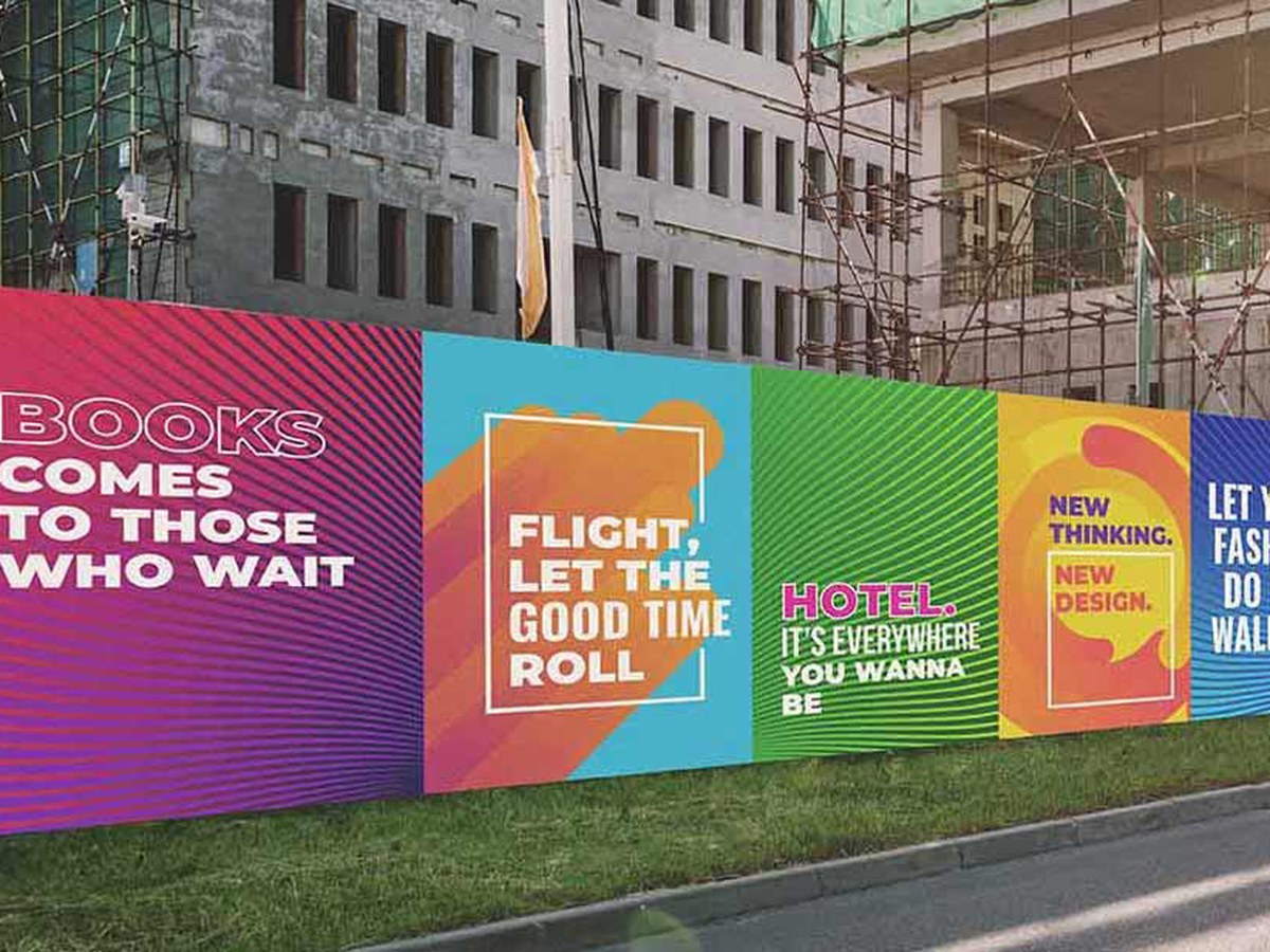 Printed construction hoarding panels along a building site